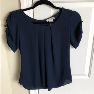Navy blue dress blouse with button on sleeve